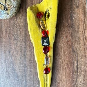 Yellow Wooden Wall Art with Red Accents